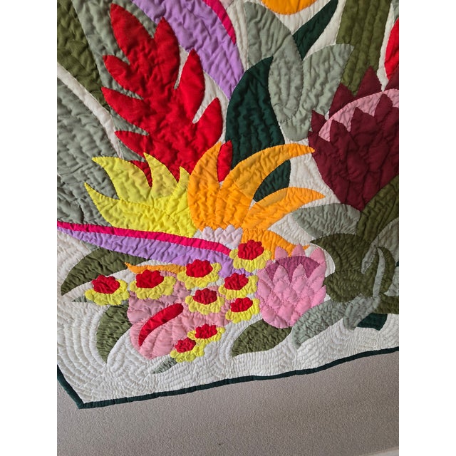 The Hawaiian Floral Quilt is a beautiful hand-quilted and hand-appliquéd blanket/wall hanging measuring 40x40 inches,...