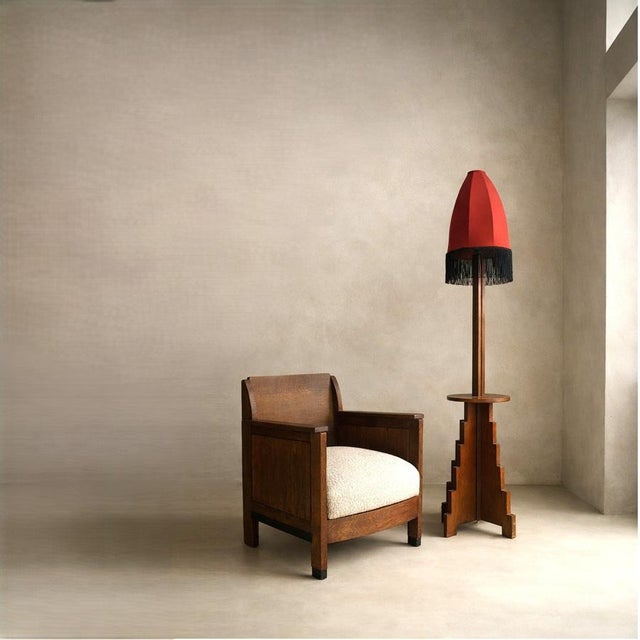 A striking Dutch Art Deco floor lamp from the 1920s, executed in oak and conceived with the strongly architectural spirit...