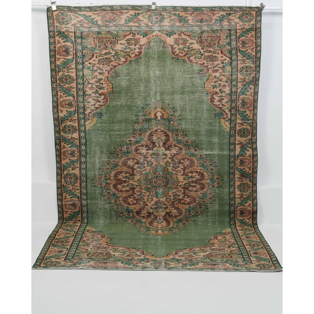 Vintage Hand-Knotted area rug is a semi-antique vintage area rug. The '70s Eastern region of Anatolian's unique rug is...