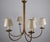 Large brass chandelier from germany, 1970s, designed with six elegantly curved arms rising from a tall central stem. The...