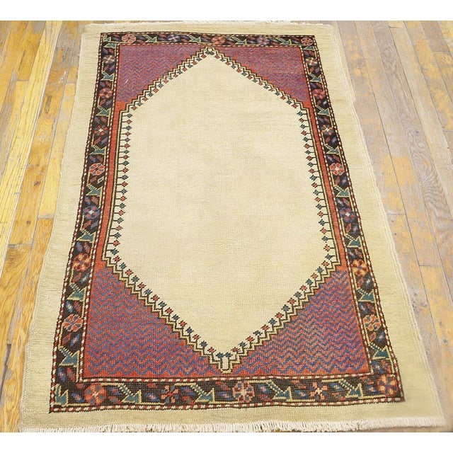 Antique Bakshaish Small Scatter Size Wool Ivory Rug, Circa Date: 1870s. This exceptional piece from the late 19th century...