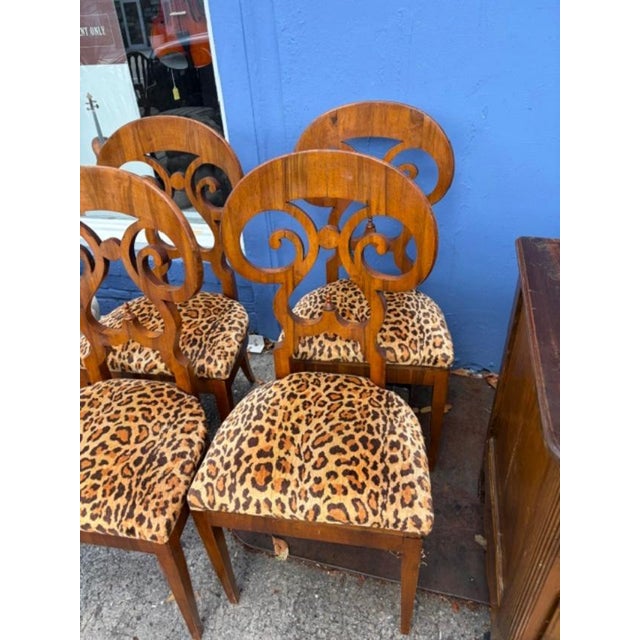 This listing features a set of four exquisite Austrian Biedermeier dining chairs from the 1840s. Handmade of wood, these...