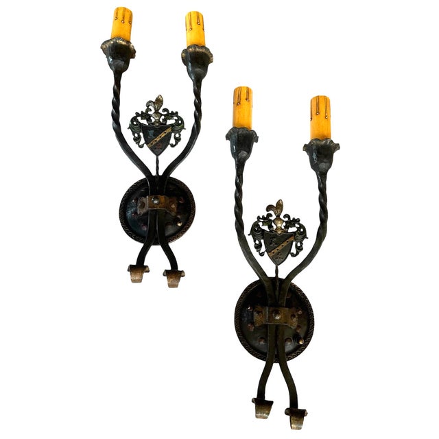 These are just fabulous sconces probably made for a Mediterranean or Tudor elements. The original old paints about the...