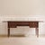 A Louis XVI-style desk, likely made around the mid-20th century, with a leather-covered writing surface and pull-out...