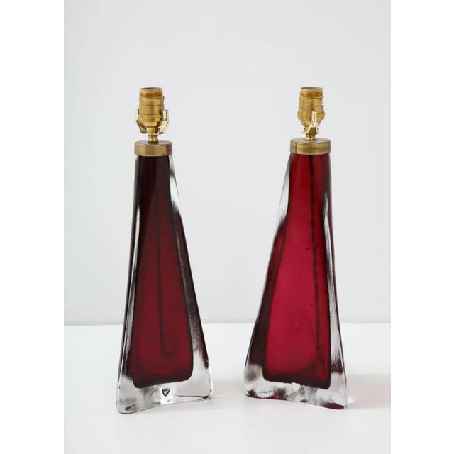 An Orrefors crystal lamp in a beautiful, deep shade of red with brass fittings. More than a lamp this is a work of art...