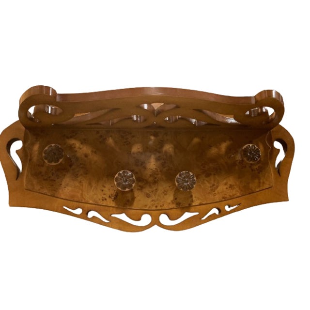 Magnificent oak coat rack finished in rosewood and ebony. Mid-Century wall hanger with shelf with four hangers shaped like...