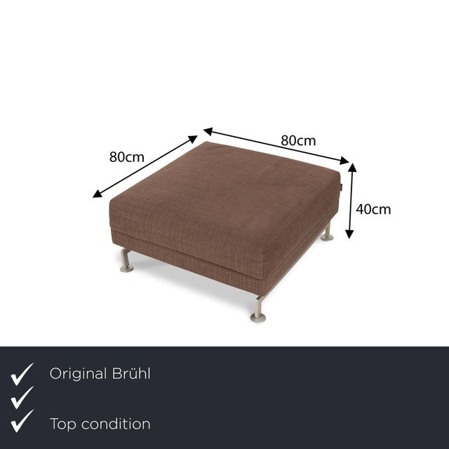 The Moule stool from Brühl is covered in a dark brown fabric and stands on silver metal feet. The simple design sets it...