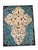 A striking piece of dimensional metal wall art featuring an ornate fleur-de-lis-inspired scrollwork motif in distressed...
