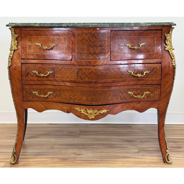 Vintage French Louis XV Style Bombe chest commode. Veneer construction with beveled edge marble top and four drawers....