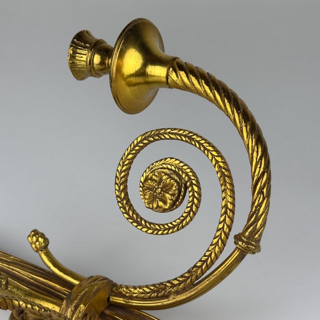Beautiful French wall sconce/candleholder made of gilded bronze, made in the form of tied ribbons supporting two...