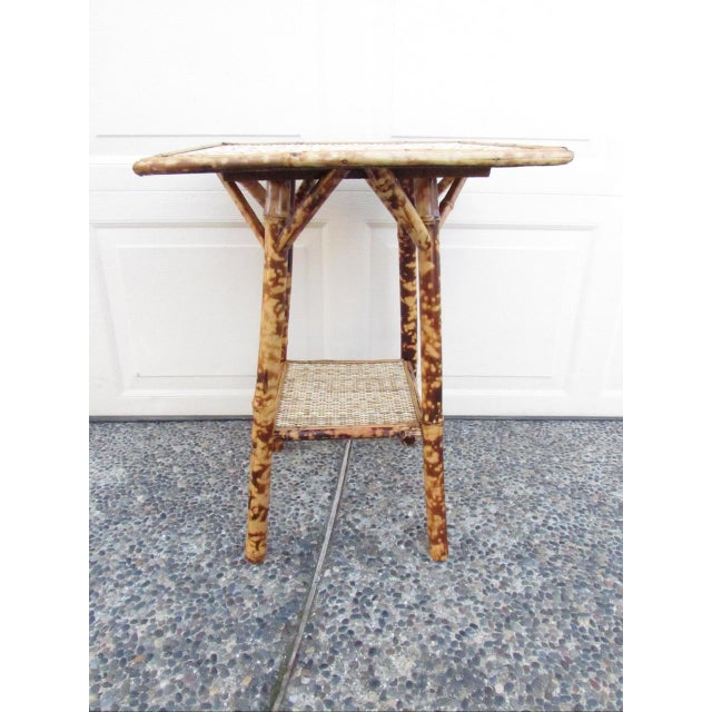 Antique English Tiger bamboo table, c.1900 Square in shape with a lower shelf, this table has been cleaned of years of...
