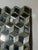 Striking sculptural wall mirror composed of a grid of three-dimensional mirrored cube facets. Each mirrored element is...