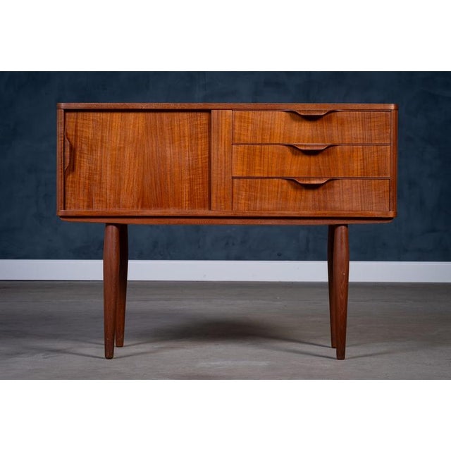 Elegant Danish mid-century chest of drawers attributed to Aksel Kjersgaard, crafted in warm teak wood during the 1960s....