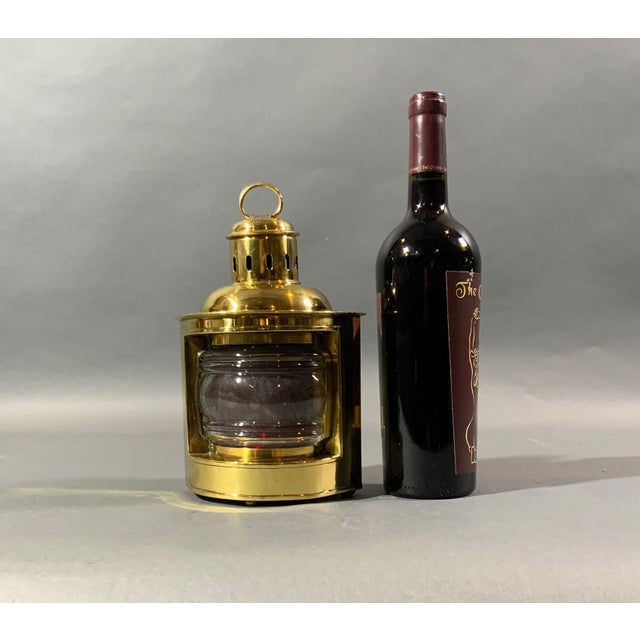 Solid brass boat lantern with very thick clear dioptric lens and removable red filter. Fitted with original oil burner....