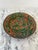 Handmade, Hand-painted and hand-glazed terra cotta plate with flora and fauna them. Image of two deer, seated. A lovely...