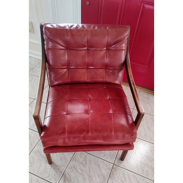 Patrician mid century modern walnut and lounge chair with original leather upholstery. Very comfortable. Walnut grain on...