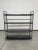 Tubular steel bauhaus etagere in very nice original condition. Tubular steel body with metal shelves.
