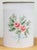 Vintage tole-painted metal wastebasket with a pale pink rose display. Top rim features a lace-like reticulated cut-out...