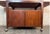 Danish Modern bar cart by Falster Møbelfabrik. Crafted in rich teak with extendable Formica top. Features ample adjustable...