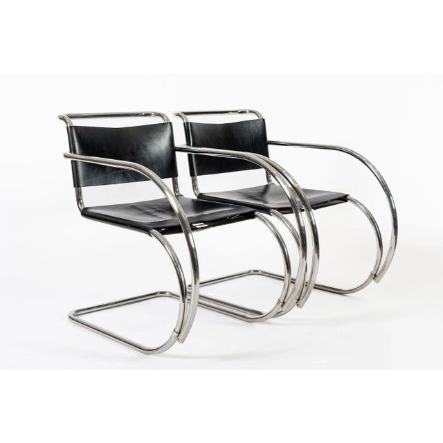 This pair of vintage Bauhaus Mies van der Rohe MR 20 black leather cantilever arm chairs were made by Knoll in 1979. The...