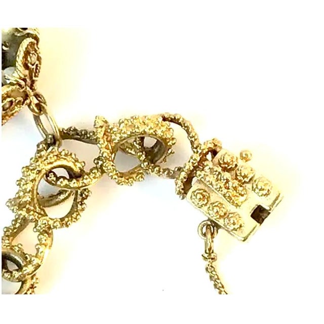 14k Gold Charm Bracelet With Charms (Two Jewish or Hebrew theme charms), interlocking circles , bead detail accents,...