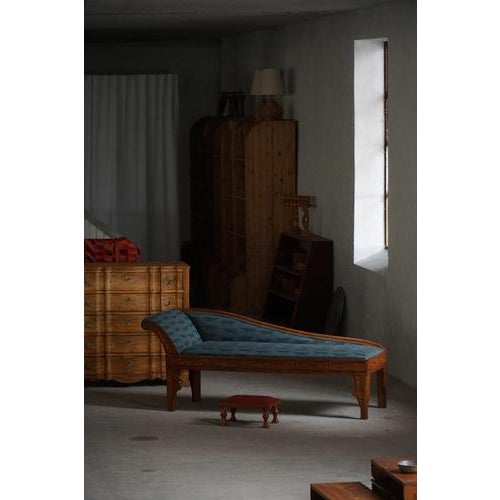 A characterful early 20th century Art Nouveau chaise canapé in solid oak, reflecting the decorative traditions of Danish...