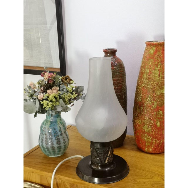 Modern table lamp, with richly decorated stem and white matte glass shade, from the 1970s. Quality piece available in nice...