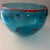 This hand-blown Murano-style studio art glass bowl in the most beautiful Mediterranean blue features a bright red rim. Red...