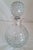 A distinctive vintage British spirit decanter by Camelot Silverware Ltd, dating to 1991 and combining finely cut glass...