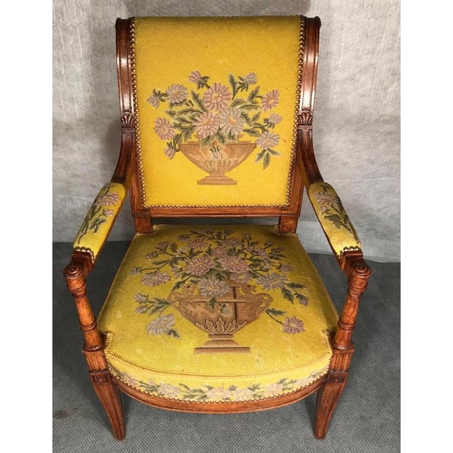 A set of three armchairs, Directoire style, France, 19th century These elegant chairs are made of maple wood and have...