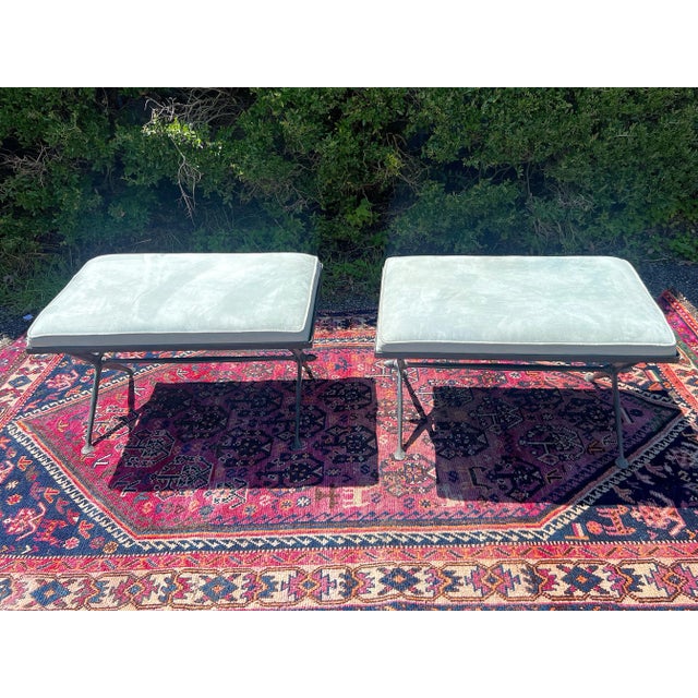 A pair of Vintage Iron X Base Blue Suede Benches With a slight touch of verdigris and sleek empire legs. Welcome to Solid...