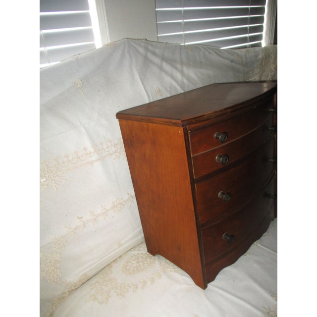 This is a Beautiful! Vintage Federal Style Miniature Walnut Bow Front Chest of Drawers which has Three Drawers with Fancy...