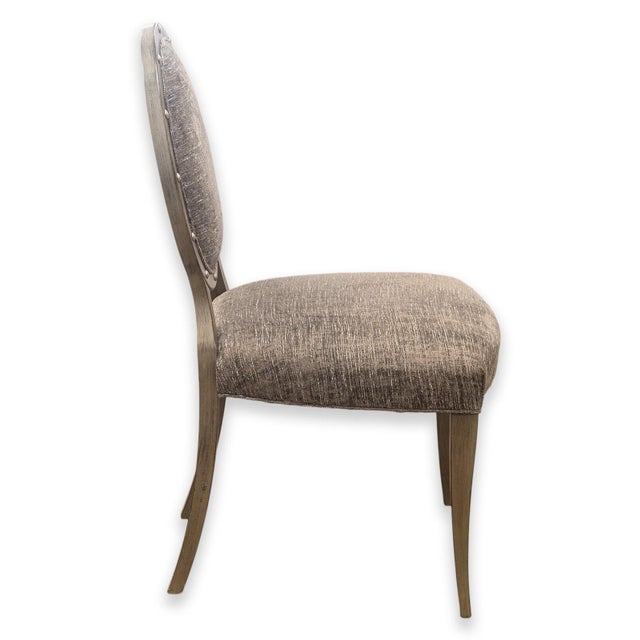 A contemporary modern Restoration Hardware accent chair. This wonderful chair features a classical French style and...