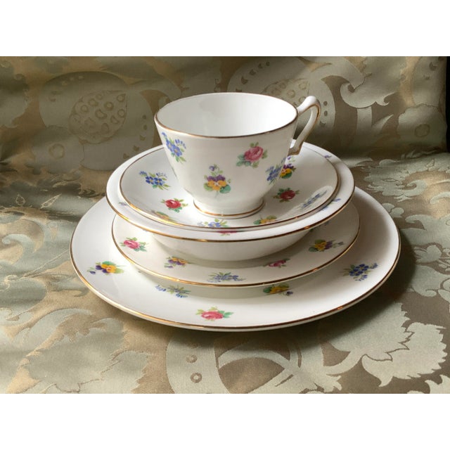 A delightfully charming English Staffordshire breakfast suite that brings cottage garden elegance to your morning ritual....
