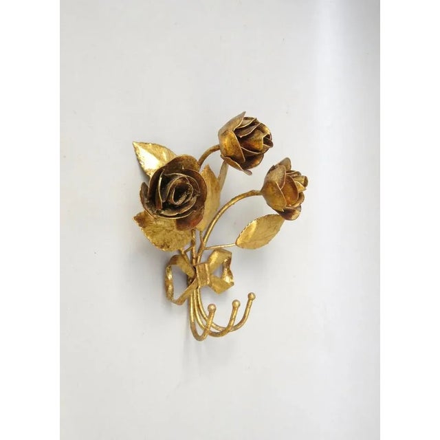 A small wall hook, 3-fold in the Florentine style from the stars. The small wall hook with 3 roses and leaves can be used...