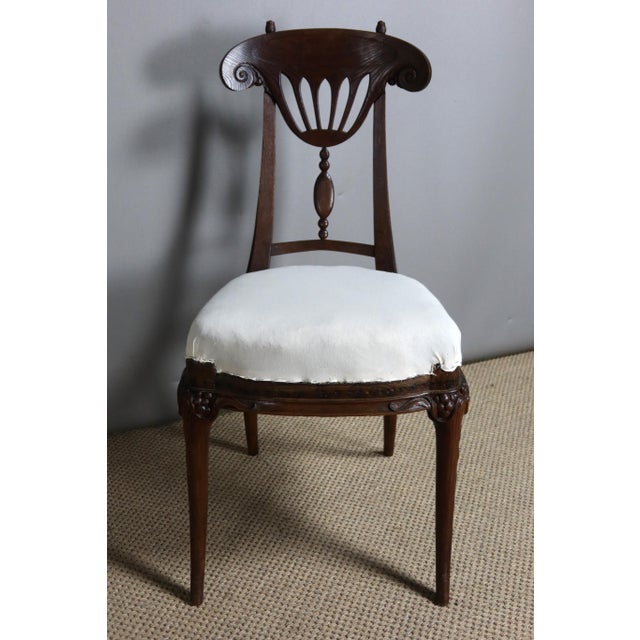 Very beautiful carved oak chair from the late 19th and early 20th centuries from the Art Nouveau period. This chair with a...