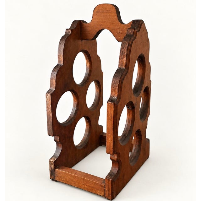 Before wine storage became sleek and minimal, pieces like this were designed to be noticed. Crafted in the 1970s to hold...