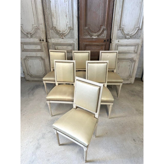 Set of six louis xvi style chairs in white lacquer, circa 1960. Fluted and reeded legs. Upholstery in good condition,...