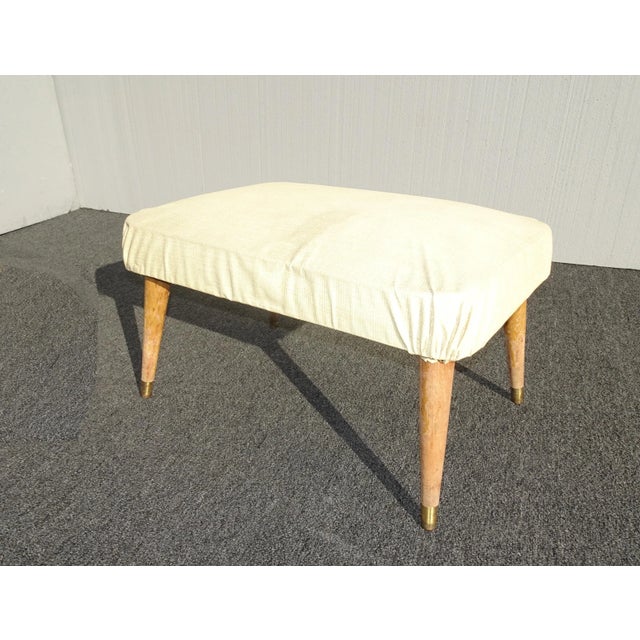 Unique Footstool in Fair Vintage Condition. Solid and Firm. But the Fabric has some stains and the legs have lost their...