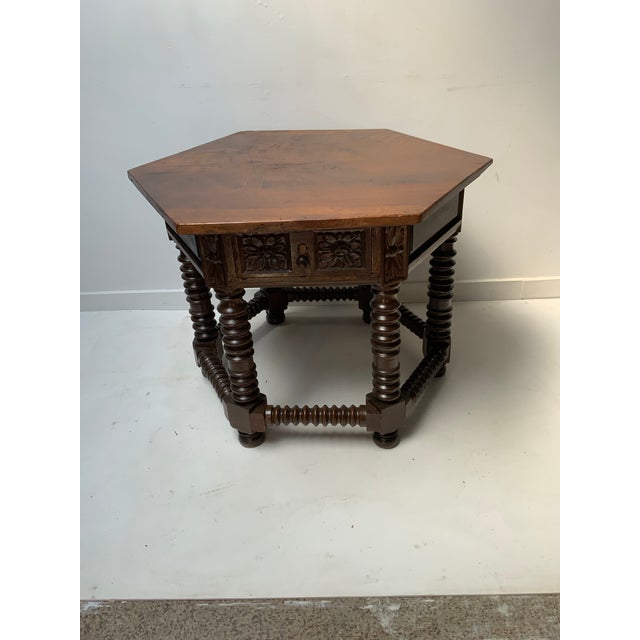 Antique Italian Walnut Hexagonal Shaped Center Table. Floral carved Drawer Panels, Turned and Carved Walnut Legs and...