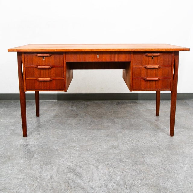 Danish floating fully finished executive desk constructed of beautifully grained teak wood. Beautiful solid teak handles...