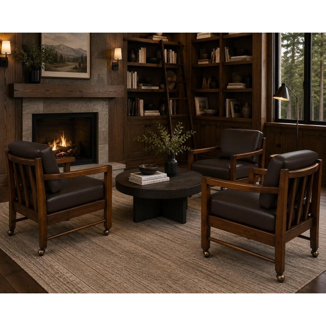 A striking and unusually architectural set of four 1980s solid wood armchairs featuring substantial hardwood construction,...