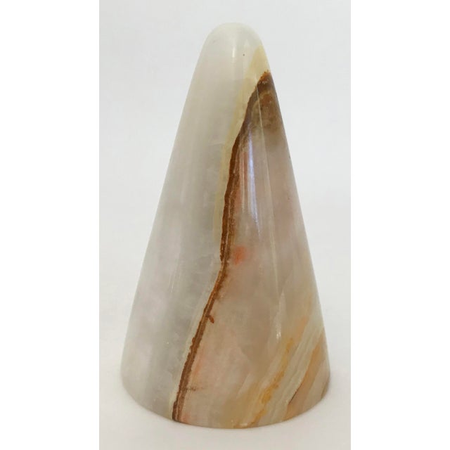 Stunning vintage onyx paper weight in conical form featuring vibrant color striations. Minor age wear. Free of chips or...