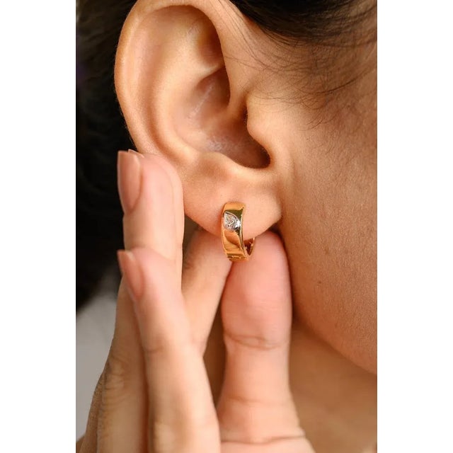This is part of Chairish’s Fine Jewelry assortment. Diamond Huggie Earrings For Women in 18K Gold to make a statement with...