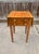 A beautifully proportioned antique American drop-leaf work table, dating to approximately 1840–1860. The top is solid...