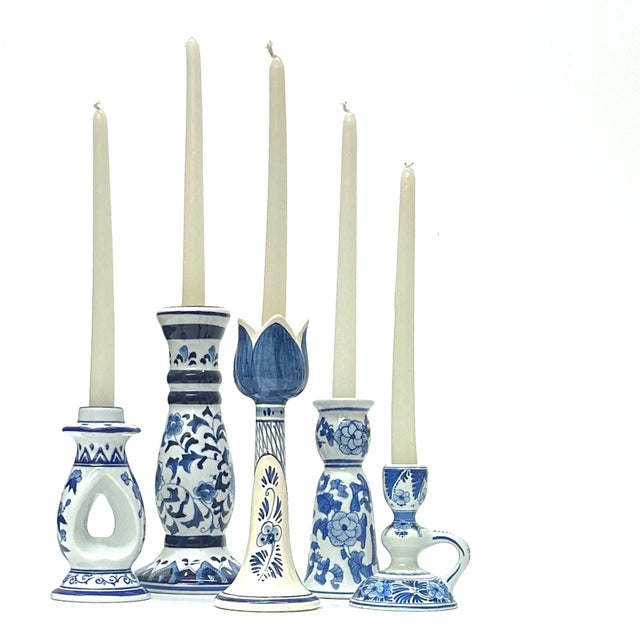 Blue and white candle holders, group of 5. A gorgeous set of mixed chinoiserie ceramic blue and white candle holders in a...