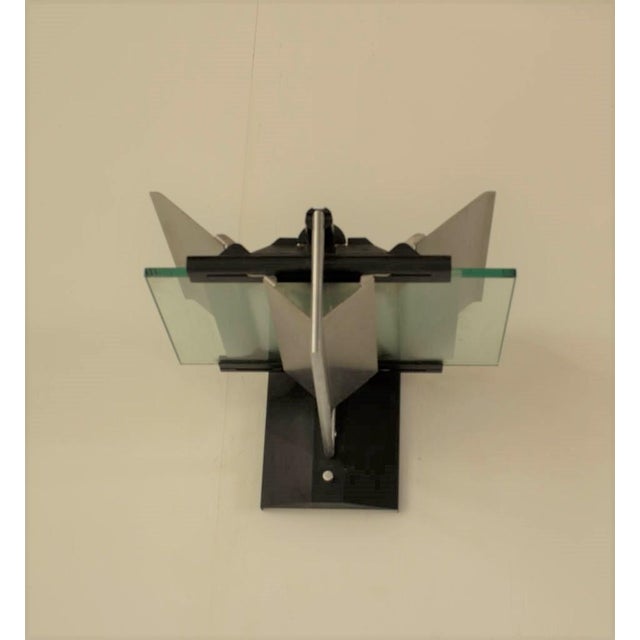 Wall Sconces By Giovanni Grignani, 1980s, These high tech wall sconces Model Dihedron feature a heavy metal frame and...