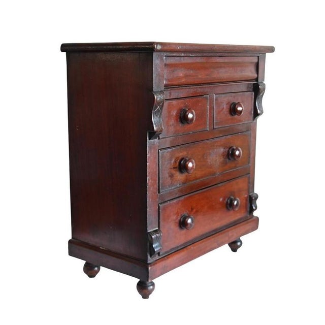 Charming apprentice piece modelled as a traditional full-sized victorian chest crafted in mahogany with two short drawers...