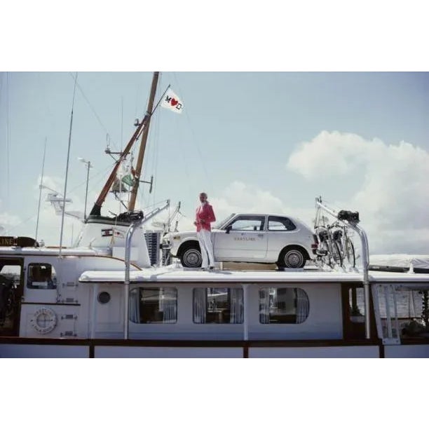 No Transport Problems 1961 Mrs Woolworth Donahue with car and bicycles on her motor yacht, ‘Hartline’. Slim Aarons Slim...