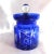 This is a blue glass, cut to clear, jelly jar, honey pot or sugar bowl with a spoon cut out in the lid. I cannot find a...